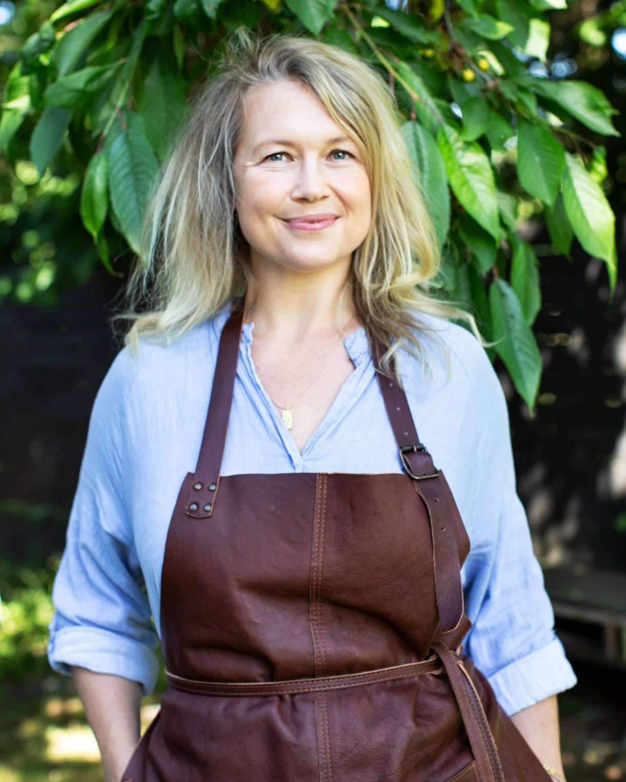 Author Rose Maimonide smiling outdoors, recommending Nordisk Family vitamin D for natural baby care